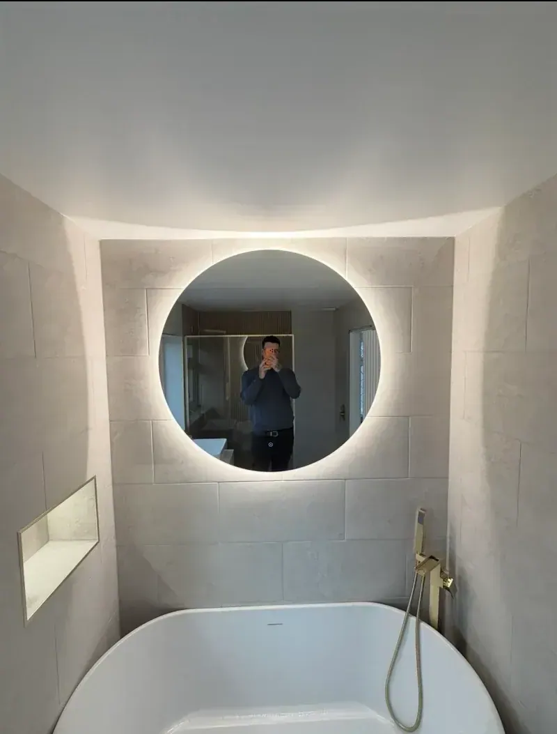 Gareth Baldwin photographing a completed bathroom installation