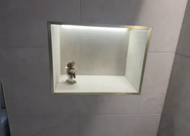 Carefully installed bathroom fixtures and tiled shower area