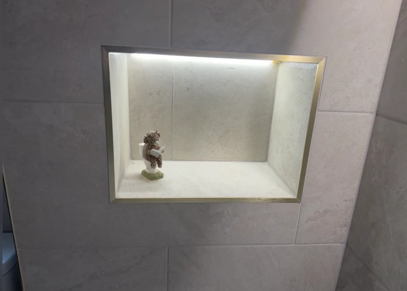 Gold-accented shower room project detail